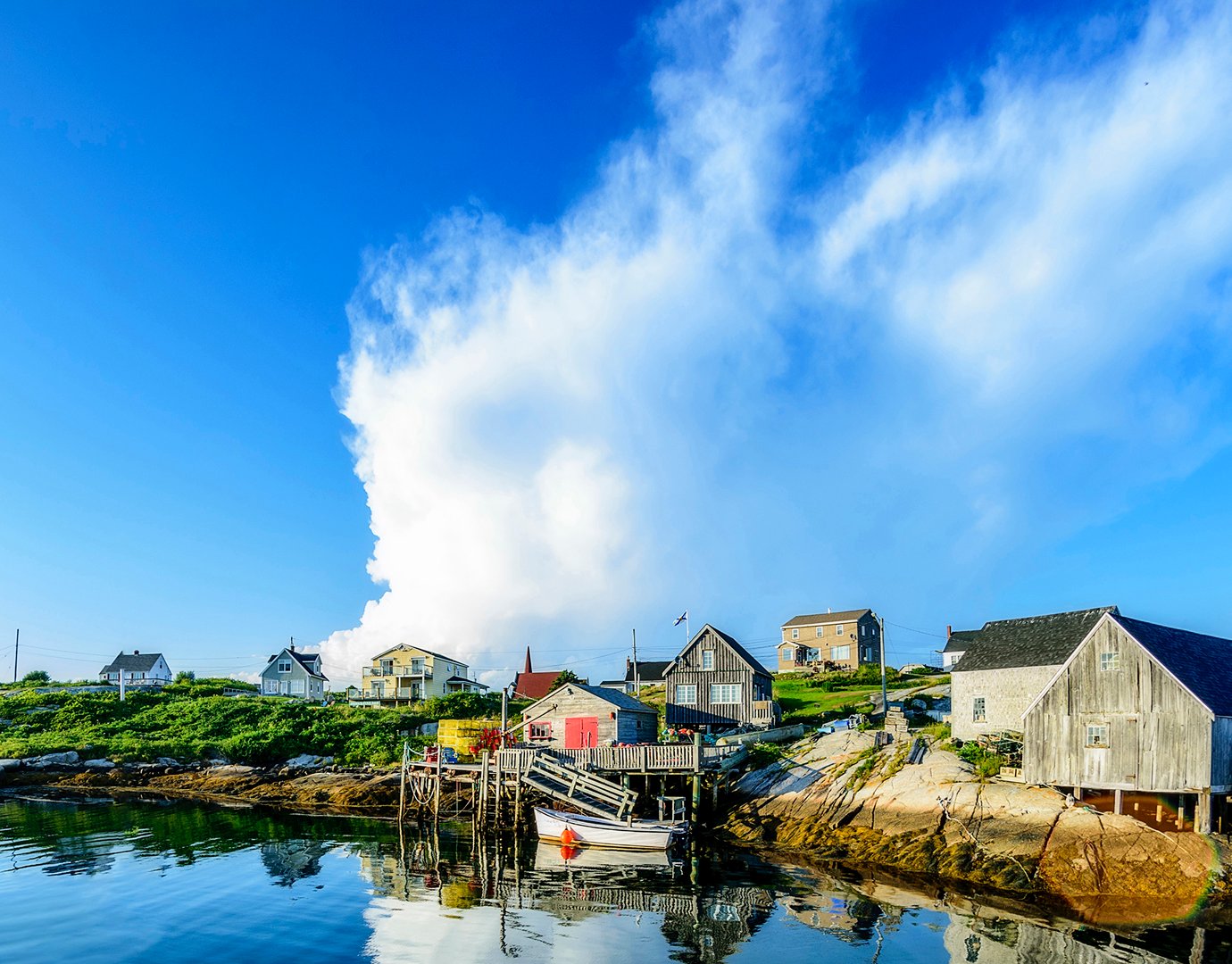 Charming coastal village with rustic houses and calm waters | MSC Cruises