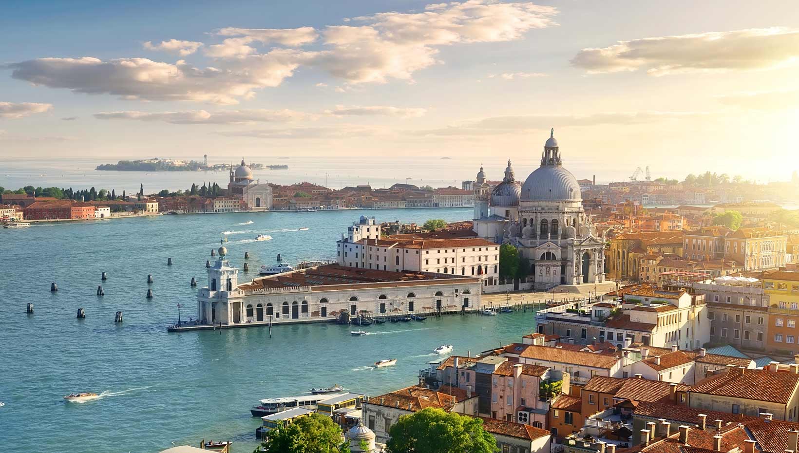 Venice's Grand Canal with historic architecture and a serene sunset | MSC Cruises Venice's Grand Canal with historic architecture and a serene sunset | MSC Cruises