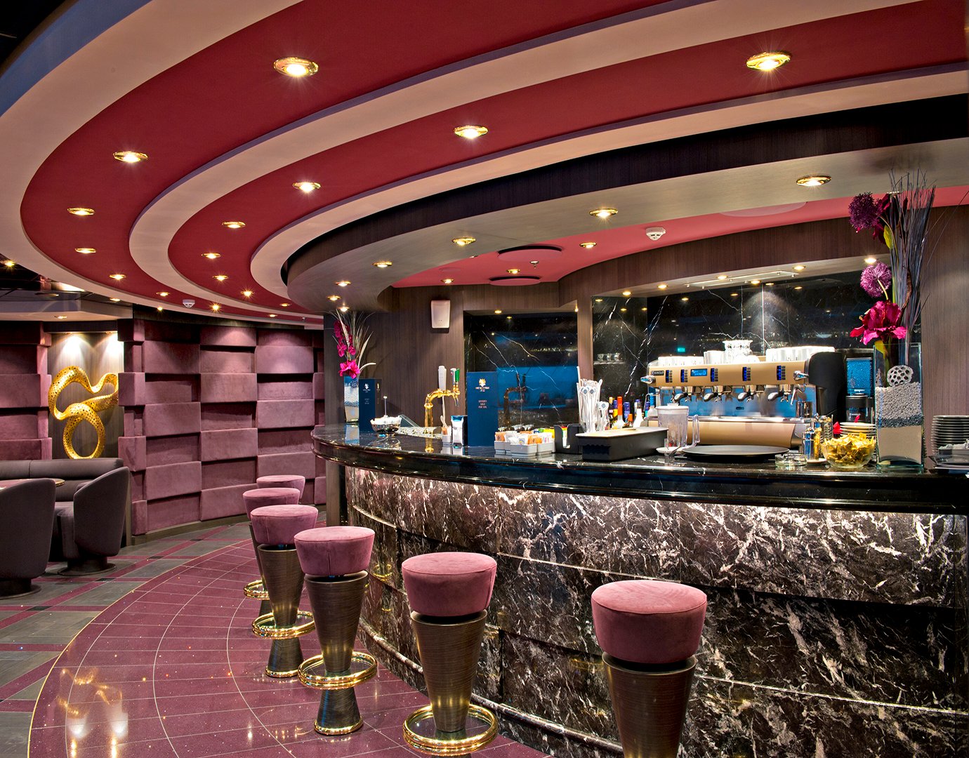 Luxurious bar with marble counters and plush seating on an MSC cruise ship | MSC Cruises Luxurious bar with marble counters and plush seating on an MSC cruise ship | MSC Cruises