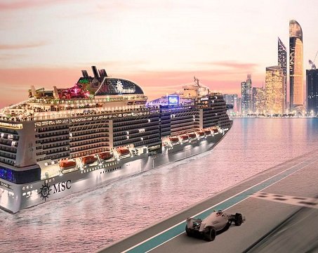 An MSC cruise ship docked near Abu Dhabi skyline with a Formula 1 car on a nearby track | MSC Cruises