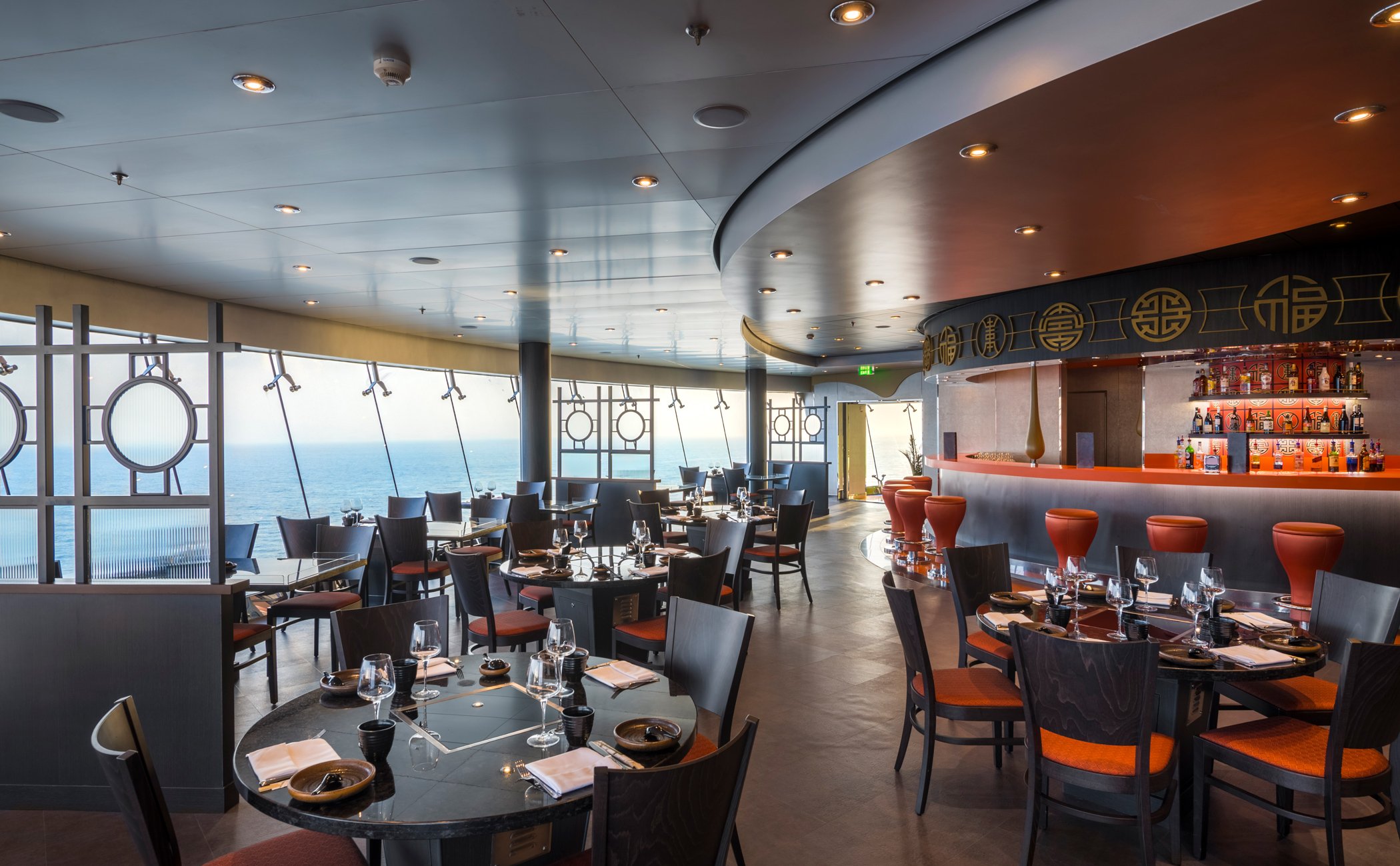 Elegant onboard restaurant with ocean view and Asian-inspired decor | MSC Cruises