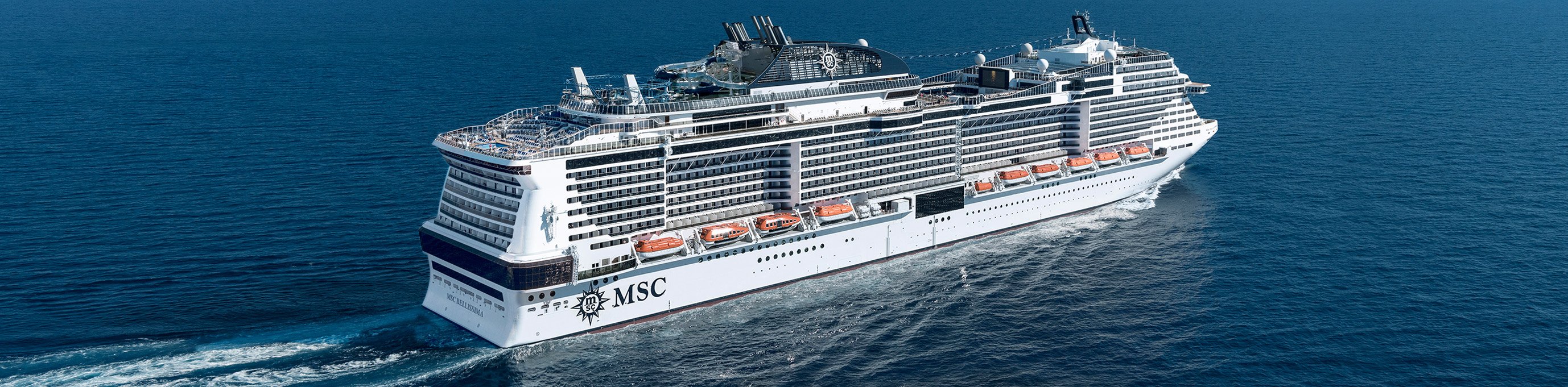 An MSC cruise ship sailing on open blue waters | MSC Cruises An MSC cruise ship sailing on open blue waters | MSC Cruises