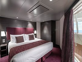 Luxurious cruise cabin with king-size bed and private balcony overlooking the ocean | MSC Cruises Luxurious cruise cabin with king-size bed and private balcony overlooking the ocean | MSC Cruises