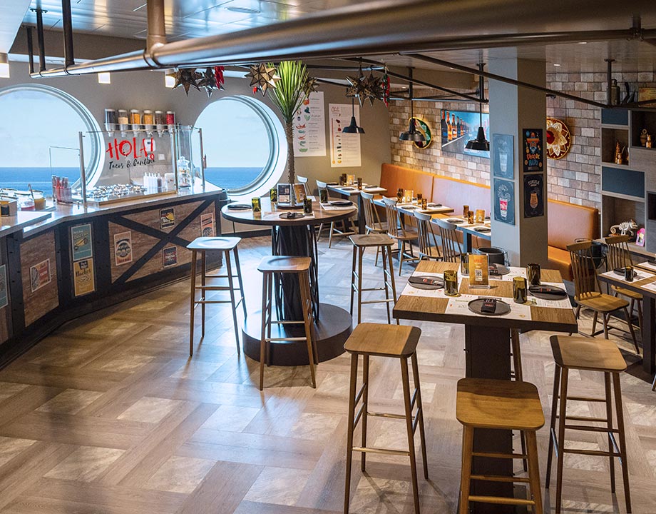 A vibrant onboard Mexican restaurant with ocean views and festive decor | MSC Cruises A vibrant onboard Mexican restaurant with ocean views and festive decor | MSC Cruises